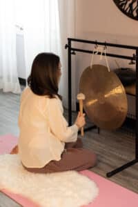 Playing gong