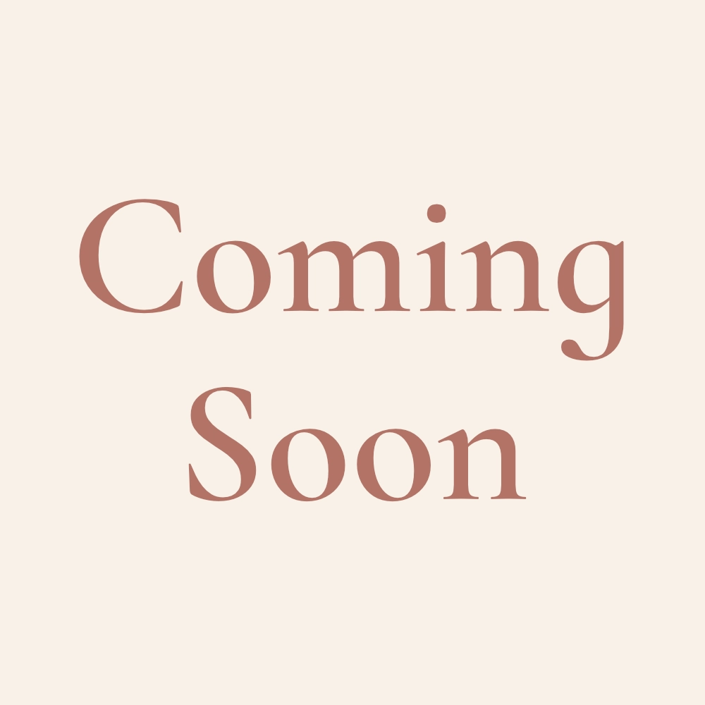 terra cotta text on a warm cream background: "Coming Soon"